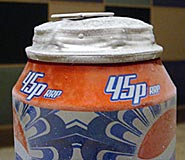 Top of a can of Pepsi with top distended