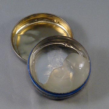 Mostly empty tip of lip balm with open cap