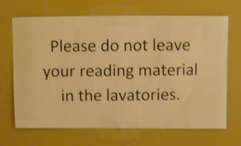 A sign saying not to leave reading materials behind