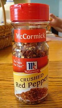 Canister of crushed peppers