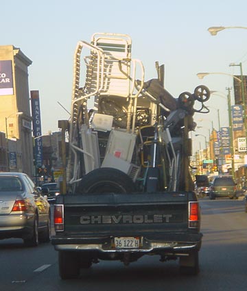 Pick-up truck overloaded with scrap metal