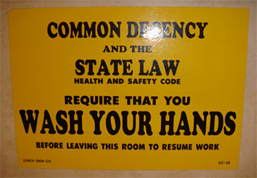 Sign advising staff to wash hands