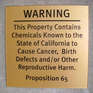 Sign warning of health hazards contained in the building