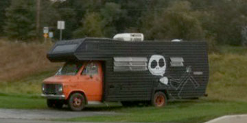 camper van painted in orange and black