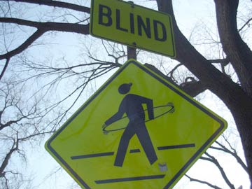 Sign warning of blind hula-hooping