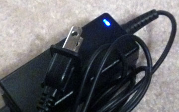 unplugged power cord with LED light glowing