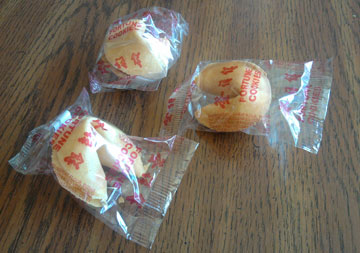 Three unopened fortune cookies