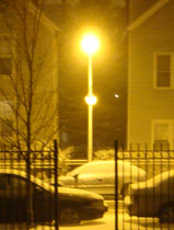 A snowy street light