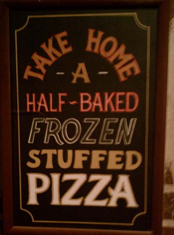 sign for half-baked pizza