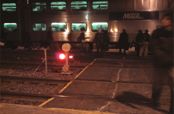 People crossing train tracks