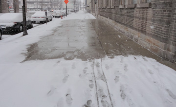 Snowy Sidewalk with melted section