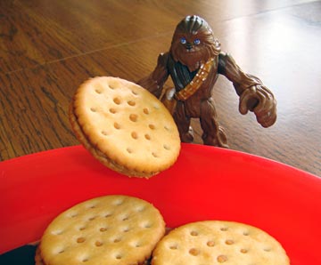 A Wookie holding a cracker
