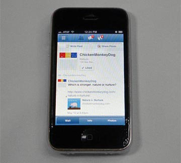 iPhone with the Facebook mobile app open