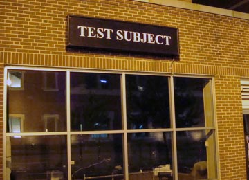 Building with test subject sign on it