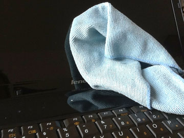 a laptop with a dust rag on it
