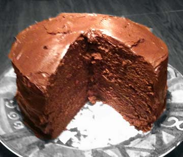 a chocolate cake with a slice gone