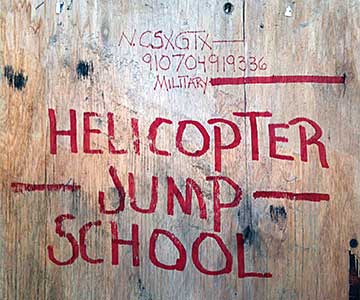 Graffiti sign reading Helicopter Jump School