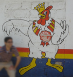 A painted chicken on a wall