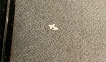 A puzzle piece on the floor