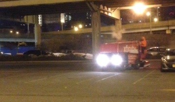 A zamboni driving in a parking lot