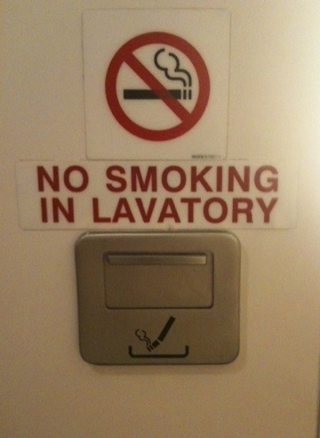 non smoking sign above ashtray