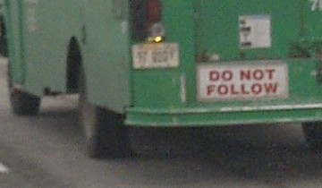 A Do Not Follow sign on the bus
