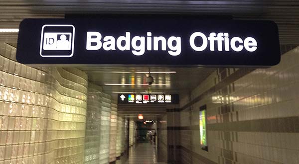 A sign for the Badging Office