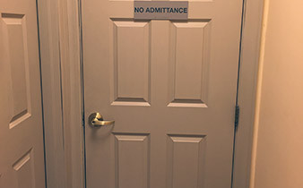 Door with a sign reading "no admittance"