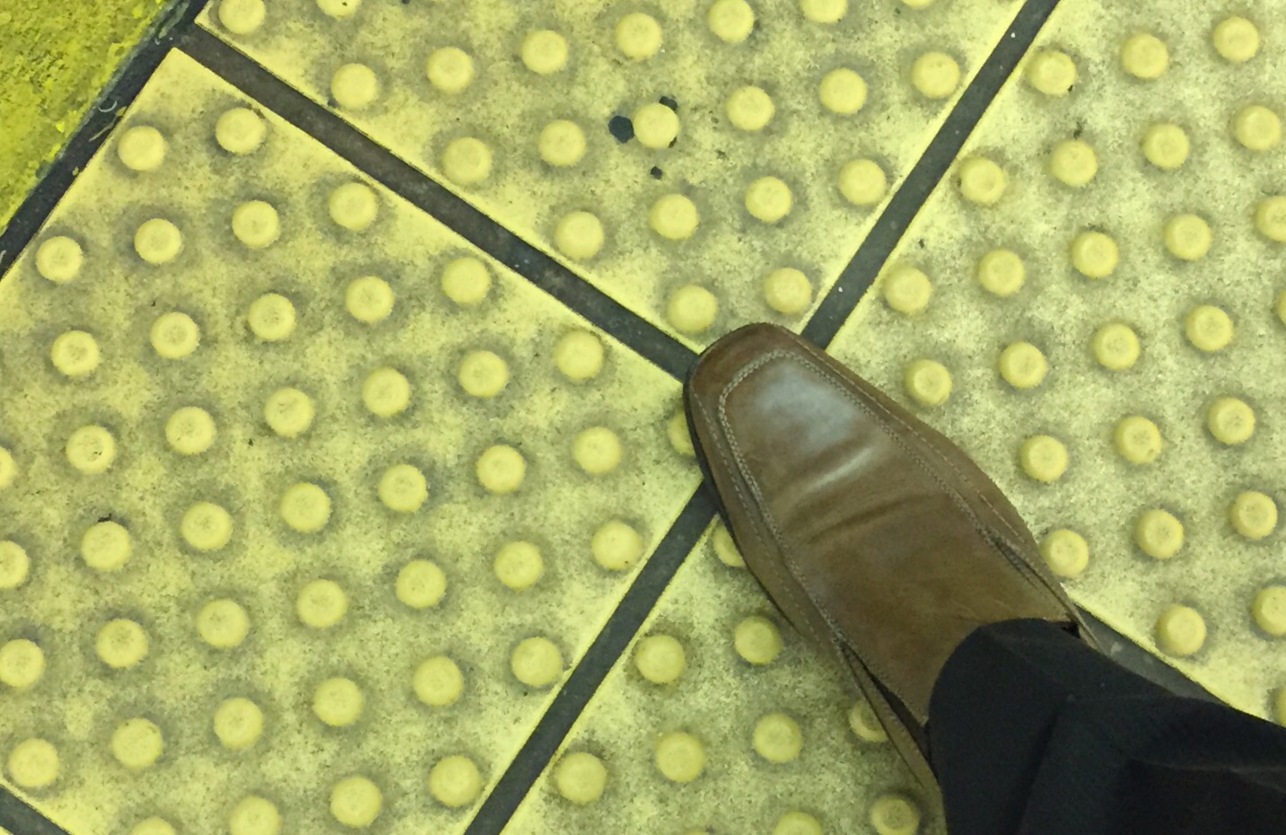 A foot on a tile