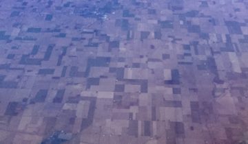 A stretch of farms as seen from a plane