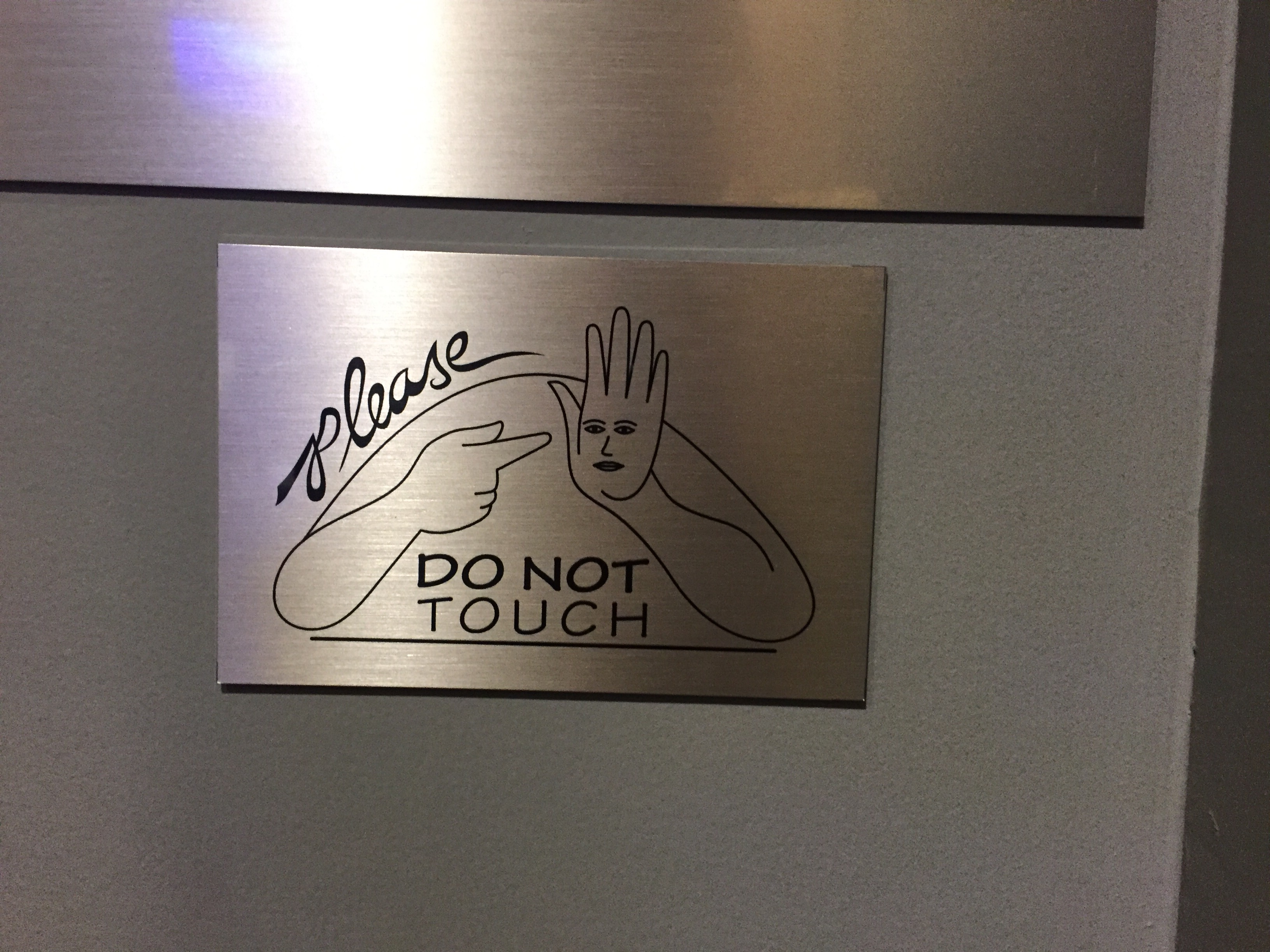 A weird do not touch sign