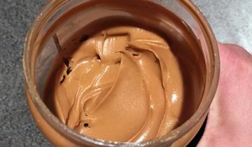 A jar of smooth peanut butter